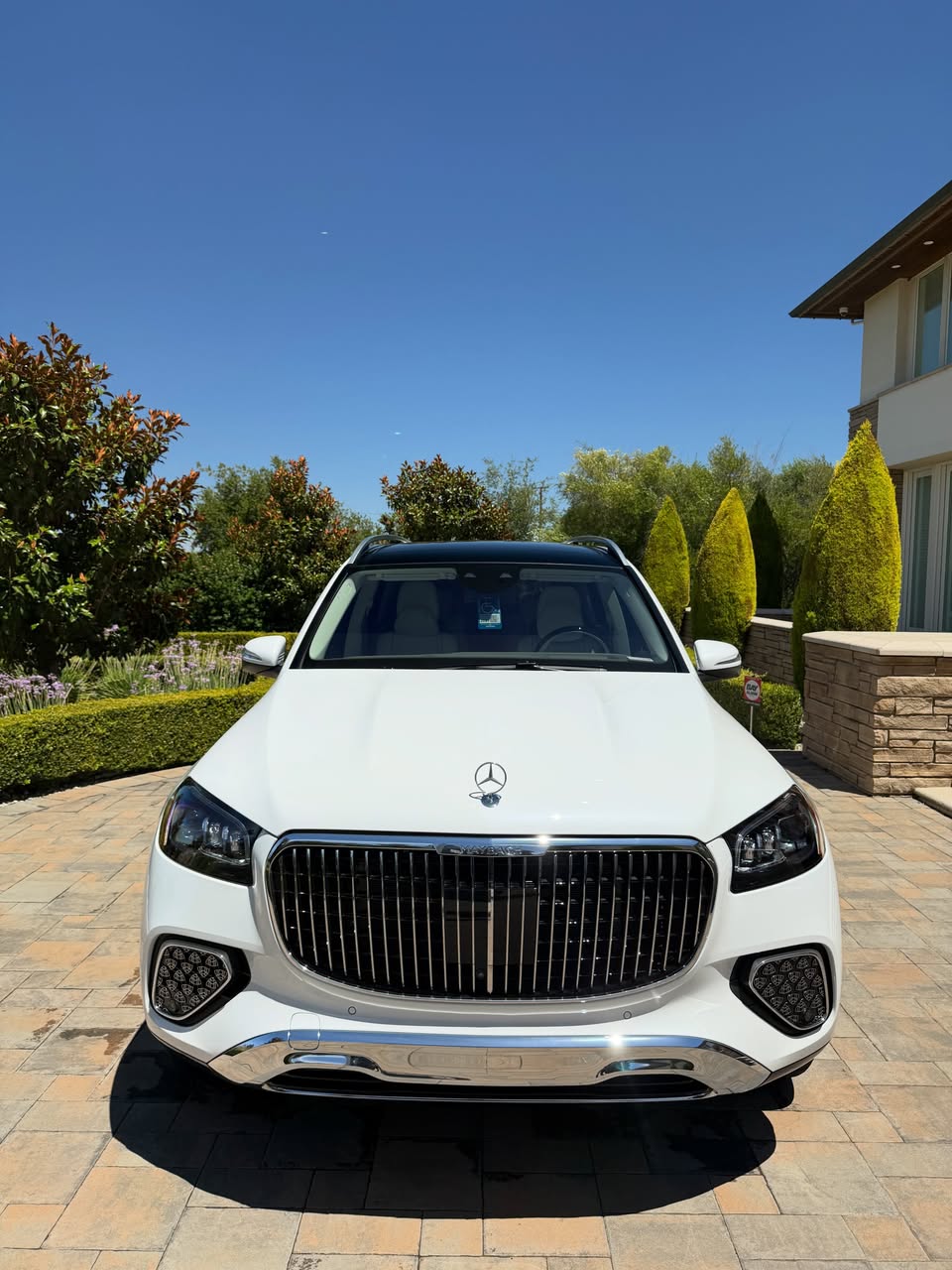 White Mercedes-Maybach GLS detailed in a driveway during a mobile car detailing appointment