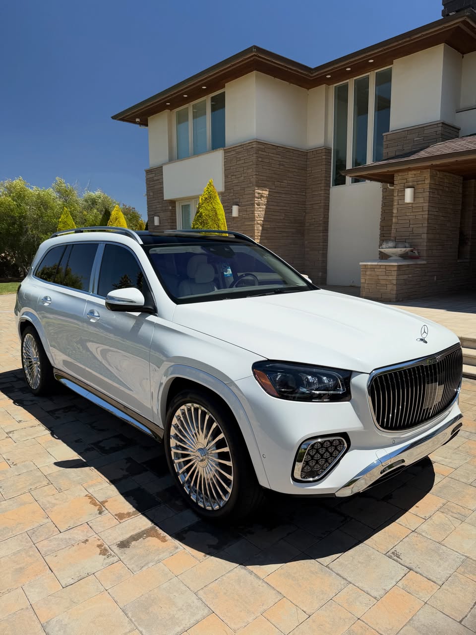 Professional detailer hand washing a black luxury sedan during a mobile car detailing appointment in San Francisco